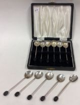 A heavy collection of silver bean top spoons.