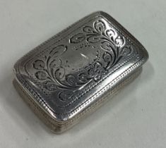 A good Georgian silver vinaigrette with engine turned decoration.