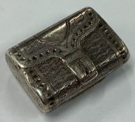 A George III silver vinaigrette in the form of a purse.