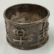 A Chinese silver napkin ring.