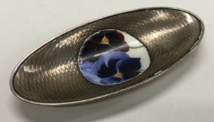 A silver and enamelled dish bearing import marks.