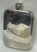 A large silver spirit flask.