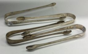 A group of four Georgian silver ice tongs.