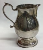 An 18th Century George II silver pitcher / jug.