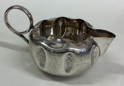 An Art Nouveau Victorian silver cream jug.