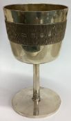 A hammered silver goblet.