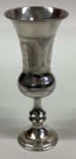 A silver kiddush cup.