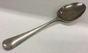 A heavy 18th Century crested silver bottom marked tablespoon.