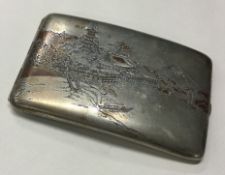 A Japanese silver and Niello cigarette case.