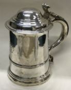 A heavy early 18th Century George II silver lidded tankard.