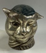A rare silver plated pin cushion in the form of a winking cat.