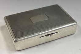An engine turned silver snuff box with hinged lid.