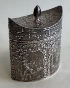 A good shaped silver tea caddy decorated with figures.