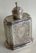 A good quality chased silver tea caddy with slidin