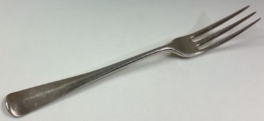 An 18th Century three-pronged silver fork.