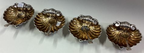 An attractive set of four silver and silver gilt salts on ball feet.