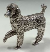 A fine silver figure of a poodle.