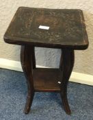 A Continental carved table.