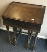 An Antique oak sloped top bible box on stand. Est.