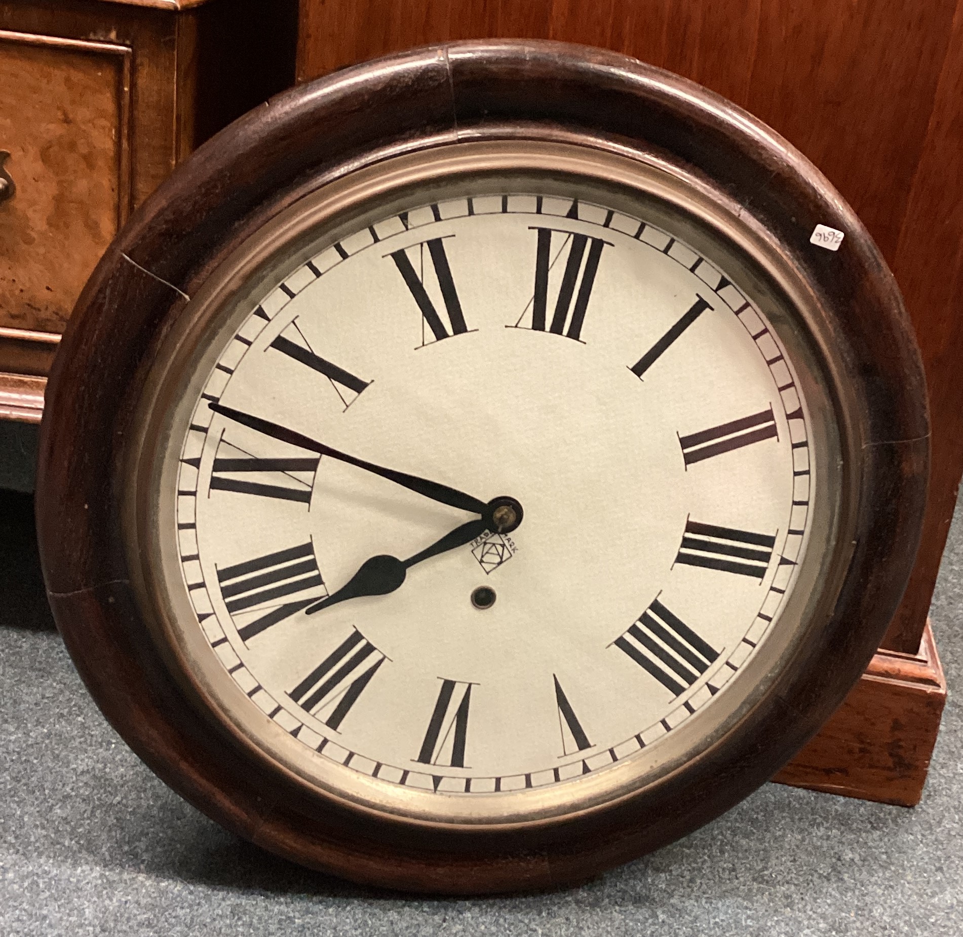 A small oak framed wall clock.