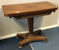 A Victorian mahogany hinged top games table.