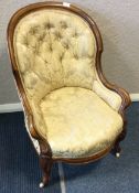 An attractive Victorian button back armchair.