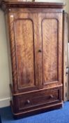 A mahogany veneered two-door wardrobe.