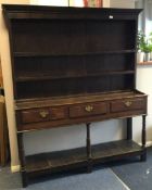 A good Georgian oak panelled kitchen dresser on tu