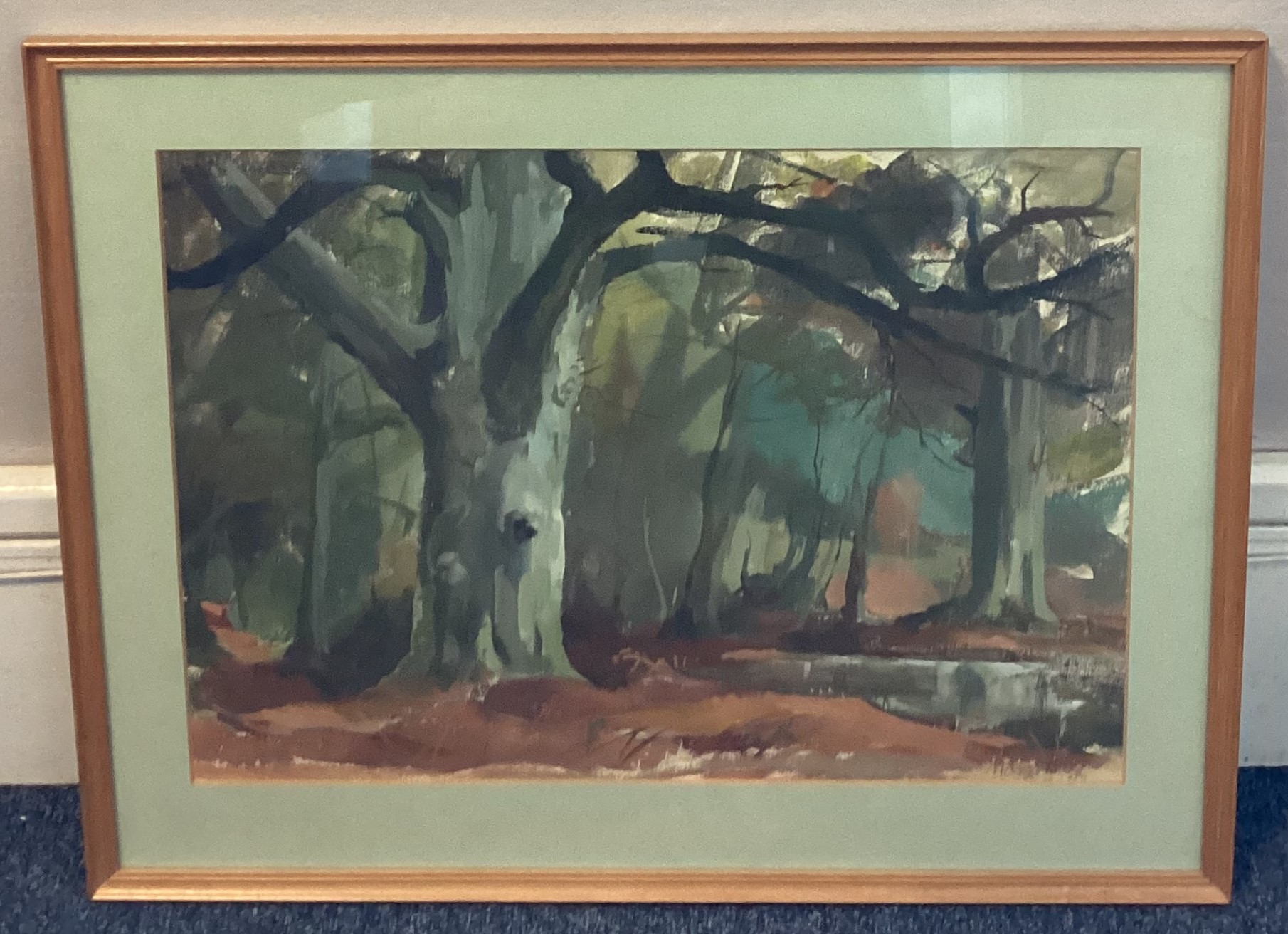 MAVIS BUDD: (20th Century): A framed and glazed watercolour depicting trees in wood.