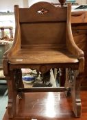 A carved mahogany hall chair. Est. £30 - £50.