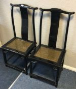 A good pair of 20th Century lacquered hall chairs.