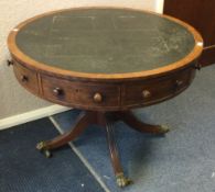 A good mahogany drum table on four spreading suppo
