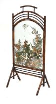 An Aesthetic Movement bamboo firescreen, the glass panel inset with dried flowers, h. 106 cm *The