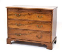 A George III mahogany bachelor's chest, the slide over three long graduated drawers, on bracket