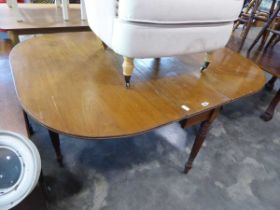 Mahogany oval drop leaf dining table on fluted supports