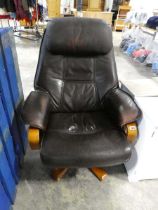 Wooden framed reclining brown leatherette upholstered easy chair