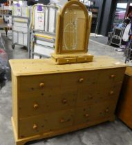 Modern pine lowboy with seven drawers and matching free standing 2 drawer mirror