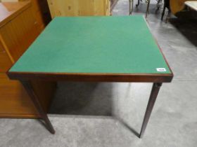 Folding wooden card table with green base surface