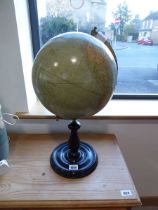 Globe on black circular stand