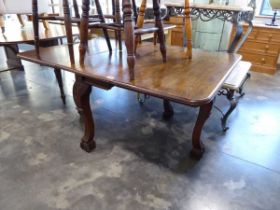 Dark oak drop leaf dining table on carved ball and claw supports