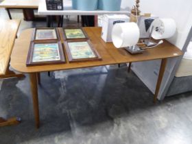 Modern mid brown wooden extending dining table on tapered supports