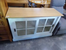 Modern white side board with glazed sliding doors and light oak surface