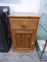 Single door, single drawer nightstand in a pine finish