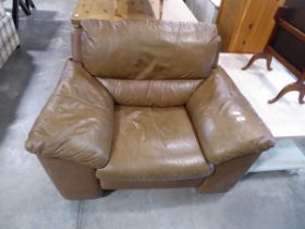 Brown leather upholstered armchair