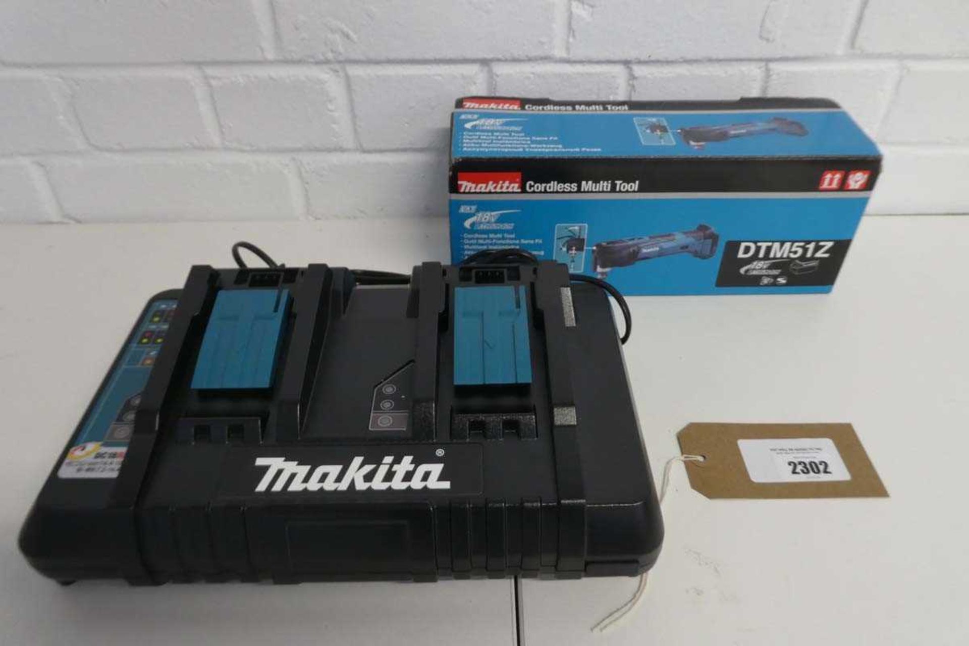 +VAT Boxed Makita 18V cordless multi tool with Makita twin slot 18V battery charger (European plug)