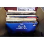 Box of vinyl albums inc. Barry White, Shirley Bassey, and The Eagles