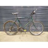 Green Raleigh men's mountain bike