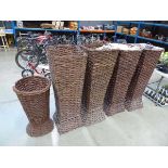 Five assorted wicker basket planters