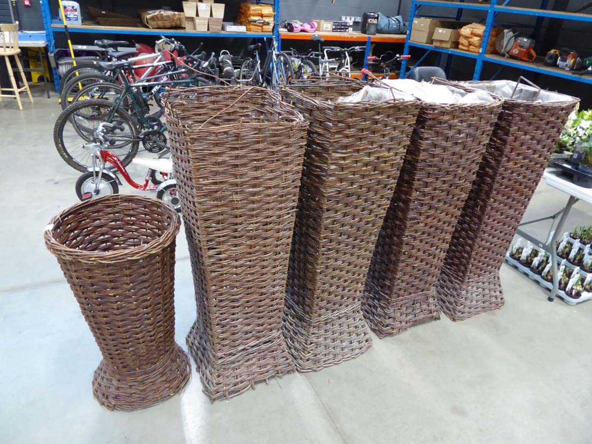 Five assorted wicker basket planters