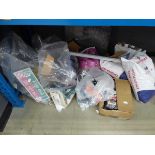 Half an under bay containing castors, Swim Stim ground bait, cat litter, mouse traps and various